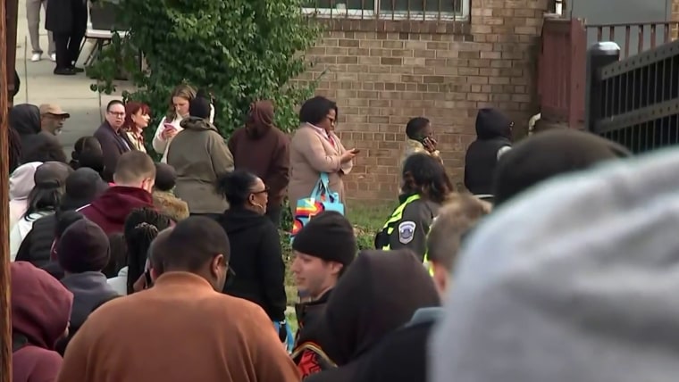 Federal workers line up at food banks ahead of first missed check since shutdown