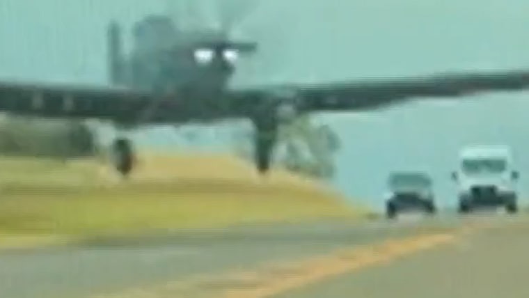 Dashcam video shows plane fly low on road