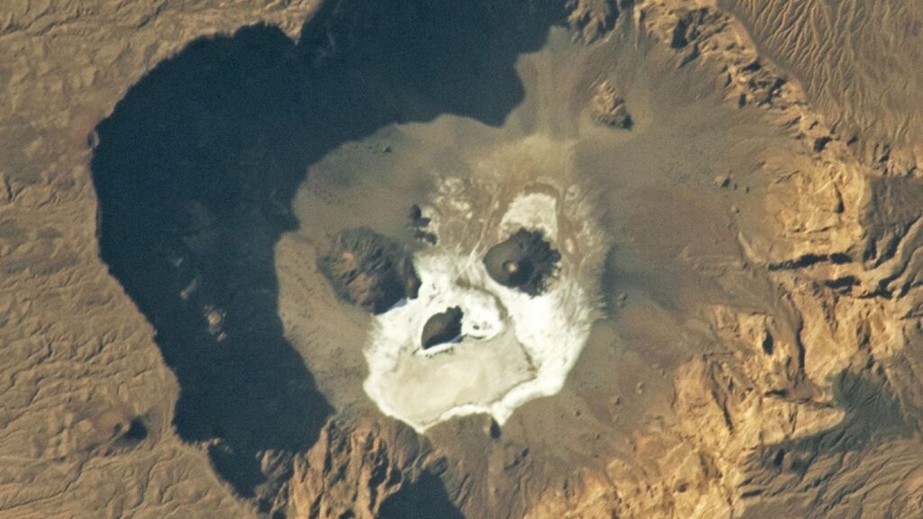 Glowering ‘skull’ stares upward from a giant volcanic pit in the Sahara — Earth from space